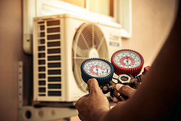 Professional Air Conditioning Service technician working in Grafton, ND